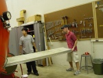 Anwar Osman and Jordan Heim loading floorboards.