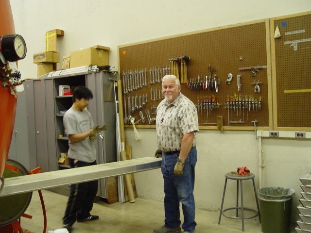 Anwar Osman and Mike Bourgeois loading floorboards.