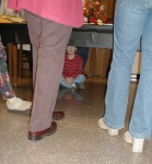 Prof. Mullen's son, Kevin, hiding under the table.