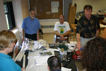 Professor Matthew Jones offers ideas during the paddle wrapping.