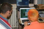 Former Purdue student, Joe Heidenreich (left), and now first year high school teacher coaches high school teacher, Matt Carlson (right) in the use of the modified e-labs.