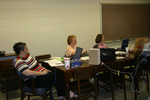 Teachers listen to a presentation by the researchers in High Energy during the Summer 2006 Institute.