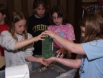 Sometimes one just has to roll up her sleeves and get her hands wet to understand which force is greater--the downward forces of water and gravity or the upward force of air pressure.