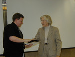 Betty Harmless of Clarion Systems presented to Eric Sword - Clarion Systems Industrial Fellow 