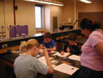 Hands-On 
ENGAGE student and pre-service teacher, Dana Davis, consults with students making topography maps