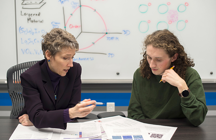 Professor Carlson working with a student