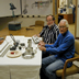 Bob De Bonte and Ken Mueller, design engineers of the new ion source, show off the first batch of parts.