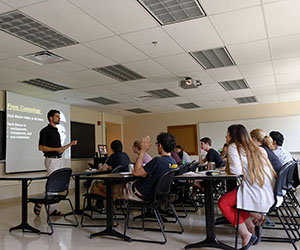 Professor Lang talking in a classroom