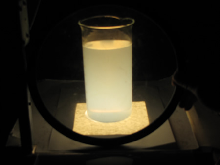 Illuminated beaker with yellow glow