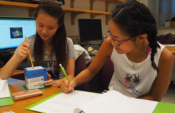 Students measure the variations in the surface inside the box.