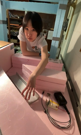 Jijun, pictured above, conducts an experiment in the lab at Purdue.