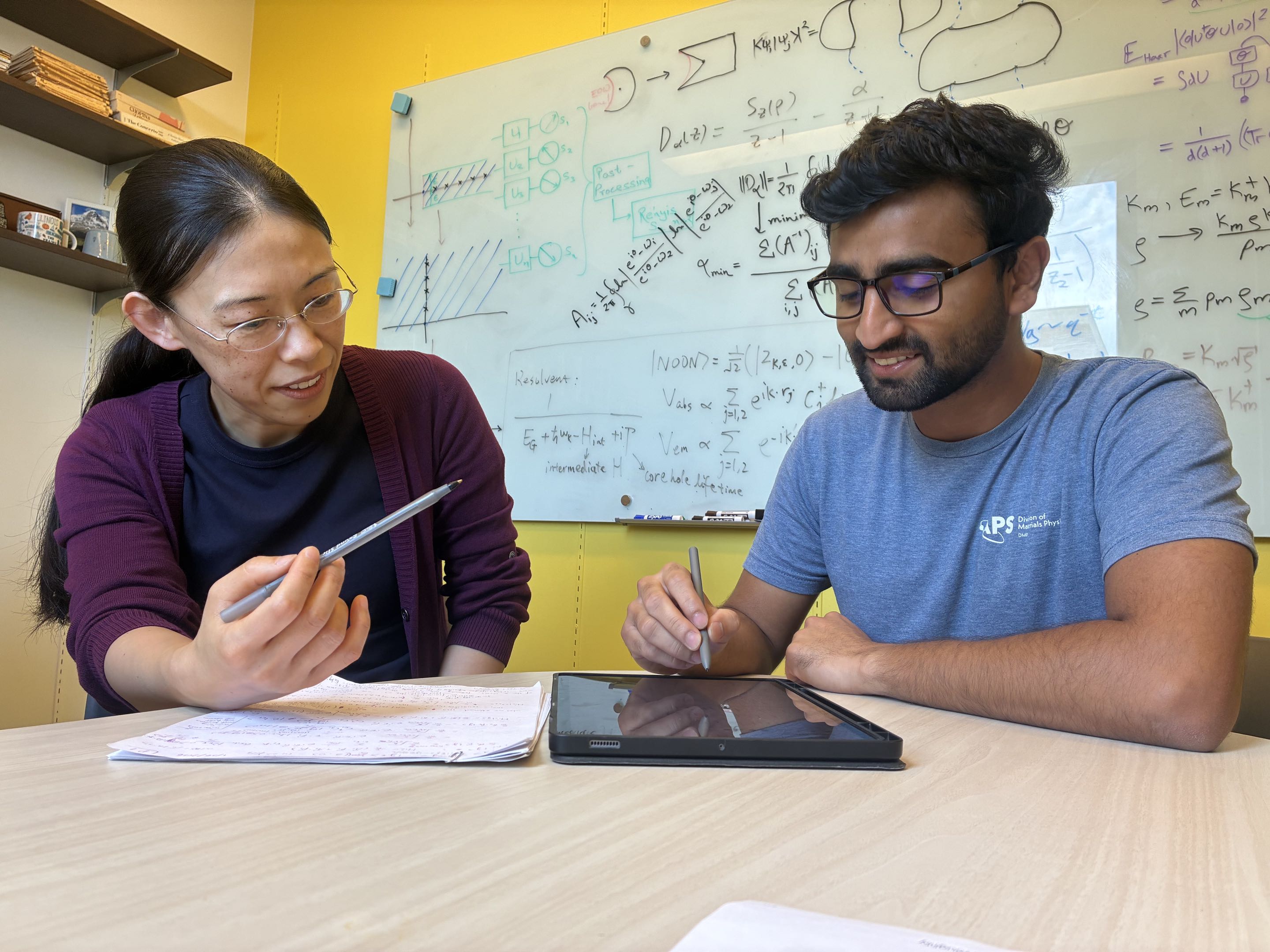 Laimei Nie, left, works with physics and astronomy graduate student Ayush Raj