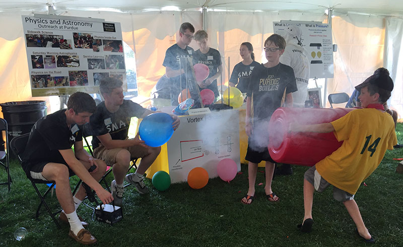 Students playing with a vortex canon