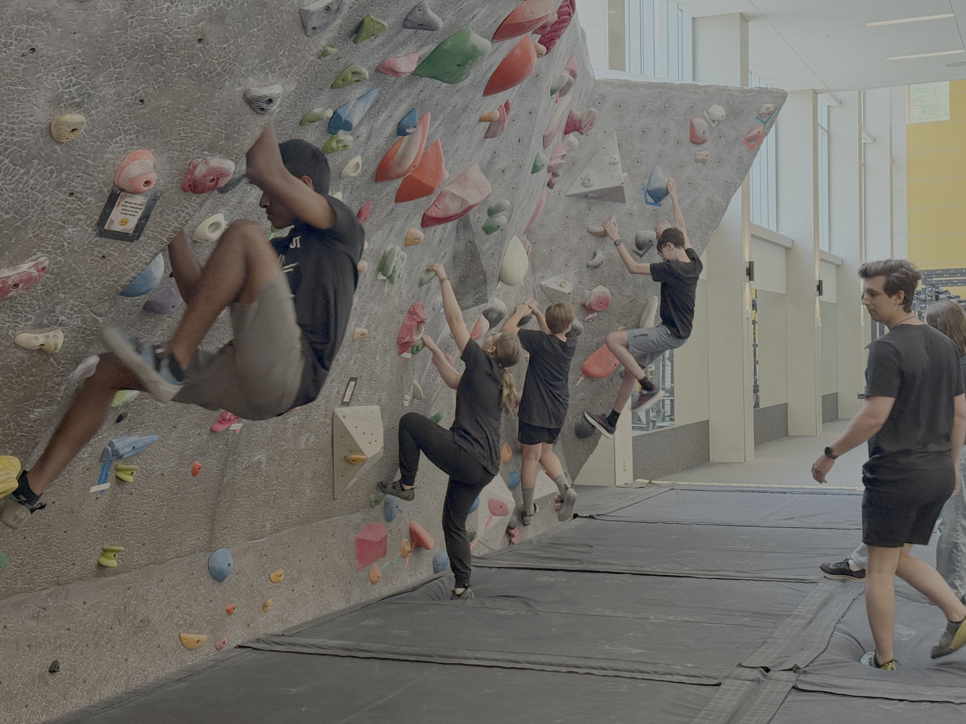 Students rock wall climbing