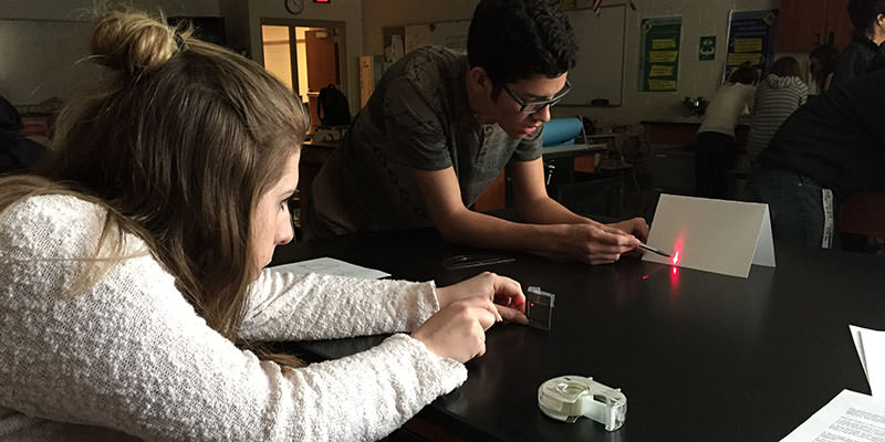 Students measuring the thickness of a human hair